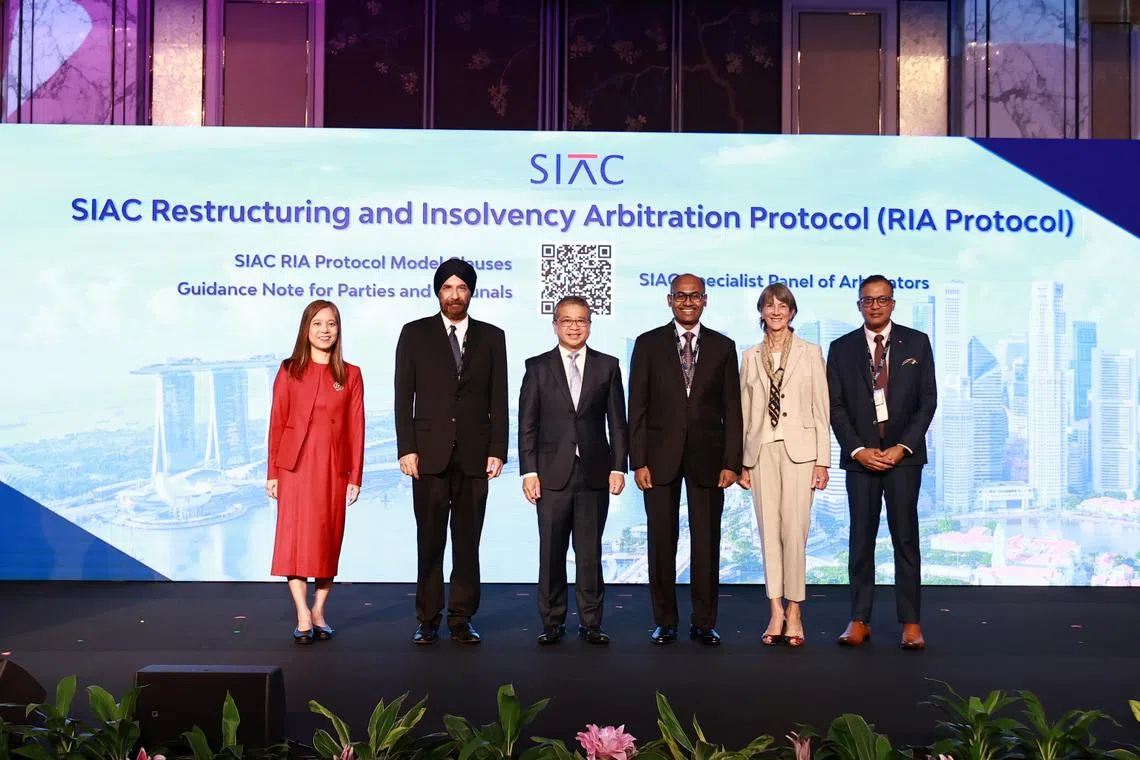 Minister for Law and Second Minister for Home Affairs Edwin Tong (third from left), Justice Kannan Ramesh (fourth from left), and representatives from the Singapore International Arbitration Centre (SIAC) officially launched the SIAC Restructuring and Insolvency Arbitration Protocol at the SIAC Symposium 2025. PHOTO: MINISTRY OF LAW