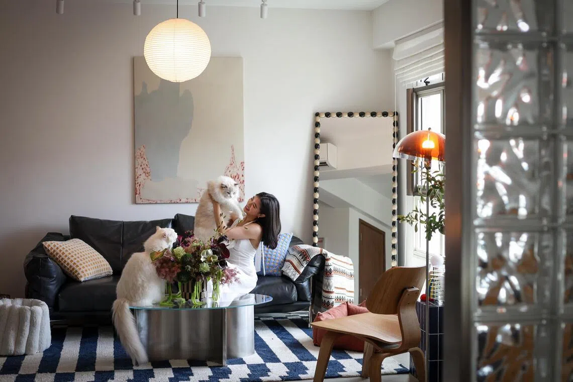 Fiona Ng and Tan Shao Wei hacked down the majority of their BTO flat’s walls, transforming it into a one-bedroom studio with just a glass-brick feature wall separating the living and sleeping areas.