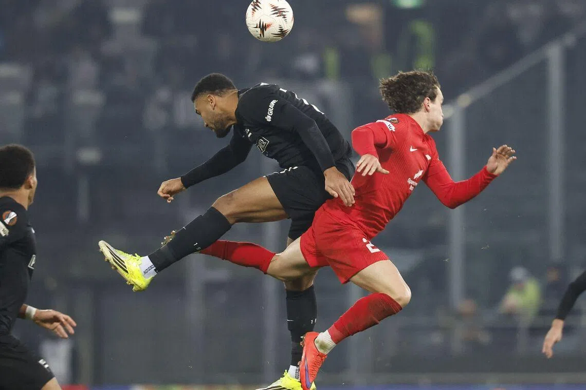 Sturm Graz's German forward Maurice Malone (L) and Brann Bergen's Belgian defender Denzel De Roeve vying for the ball during the UEFA Europa League football match between Sturm Graz and Brann Bergen in Graz, Austria on Jan 29, 2026. 