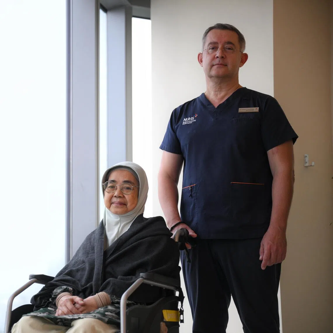 Sariah Mansoor (left), who survived an aortic dissection, with senior consultant Vitaly A. Sorokin at the National University Heart Centre, Singapore.