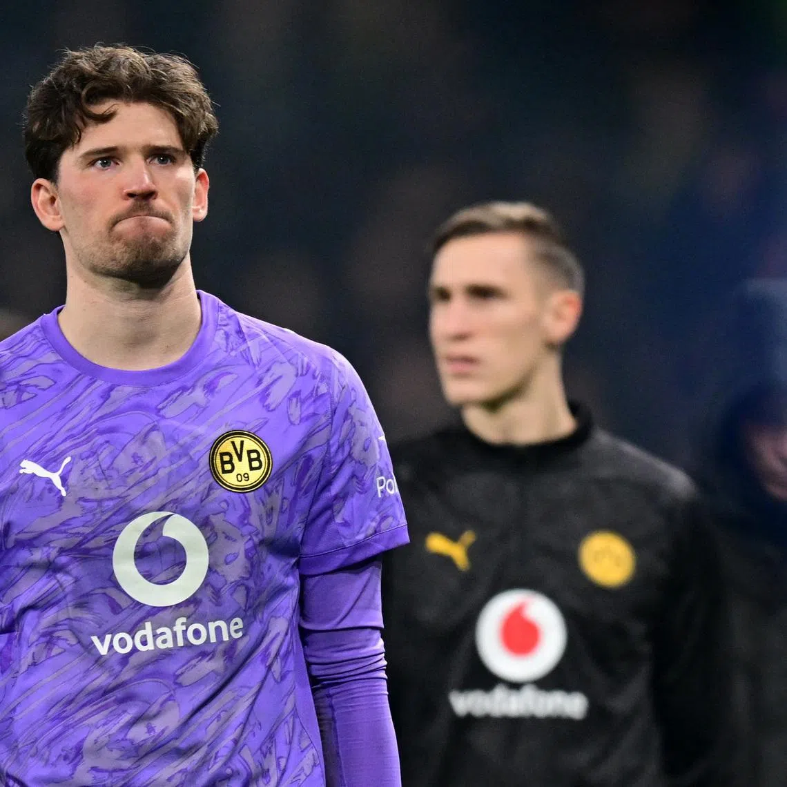 Soccer Football - UEFA Champions League - Play Off - Second Leg - Atalanta v Borussia Dortmund - New Balance Arena, Bergamo, Italy - February 25, 2026 Borussia Dortmund's Gregor Kobel looks dejected after the match REUTERS/Daniele Mascolo