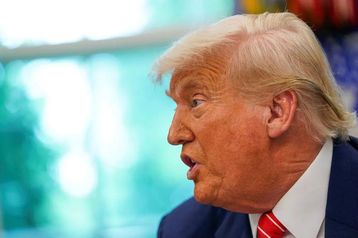 FILE PHOTO: U.S. President Donald Trump speaks during a press conference with Elon Musk (not pictured) in the Oval Office of the White House, in Washington, D.C., U.S., May 30, 2025. REUTERS/Nathan Howard/File photo