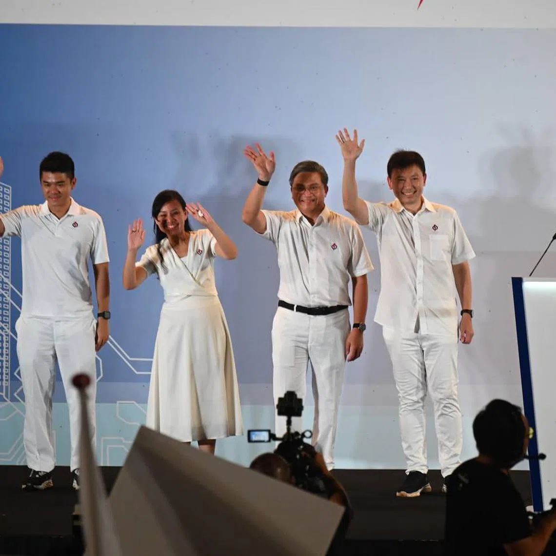 The PAP's Bishan-Toa Payoh GRC candidates (from left) Cai Yinzhou, Elysa Chen, Saktiandi Supaat and Chee Hong Tat greeting supporters at Yio Chu Kang Stadium on May 3.