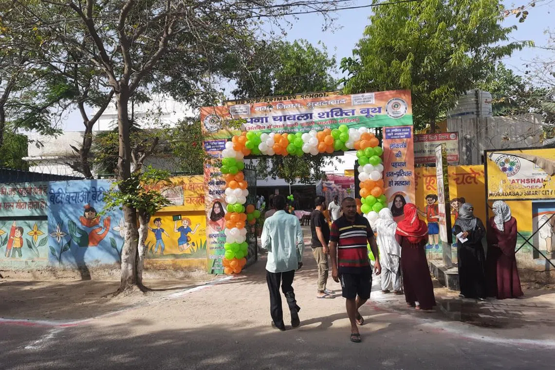 People queueing to vote in Moradabad, in the Indian state of Uttar Pradesh.