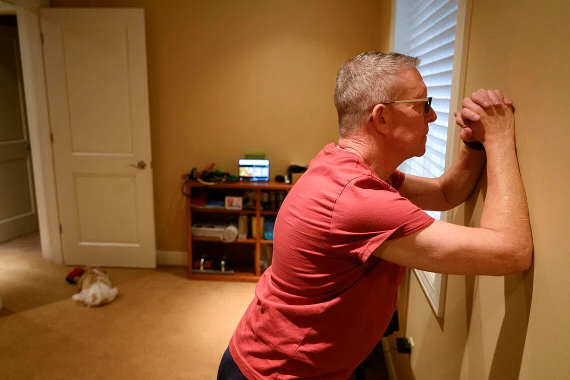 Lee Colker exercises during a virtual session with Olivia Masten, a trainer who specialises in working with cancer patients.