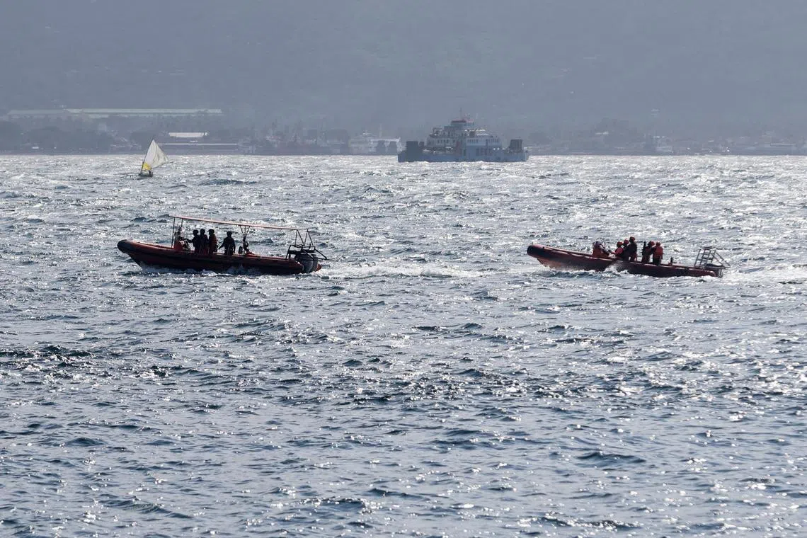 Indonesia rescue team members sail on dinghies during a search operation for missing passengers, after the KMP Tunu Pratama Jaya ferry sank near the Indonesian island of Bali, on July 3, 2025.