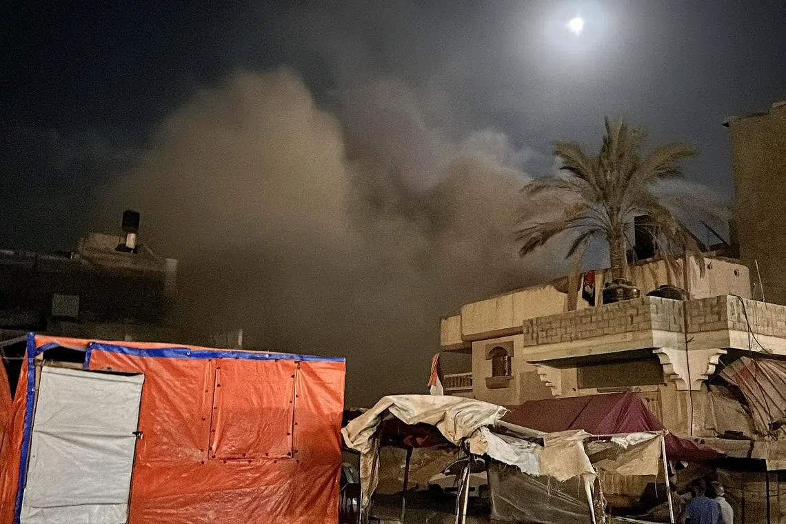 Smoke rises after an Israeli air strike on a house in Khan Younis, in the southern Gaza Strip, on June 20.
