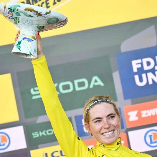 Dutch rider Demi Vollering celebrates on the podium with the overall leader’s yellow jersey after winning the 9th and final stage of the 2026 Tour de France Femmes, in Nice, France, on Aug 9.