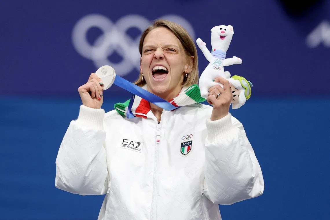 Milano Cortina 2026 Olympics - Short Track Speed Skating - Women's 500m - Victory Ceremony - Milano Ice Skating Arena, Milan, Italy - February 12, 2026. Silver medallist Arianna Fontana of Italy celebrates on the podium after finishing second in the Women's 500m REUTERS/Claudia Greco