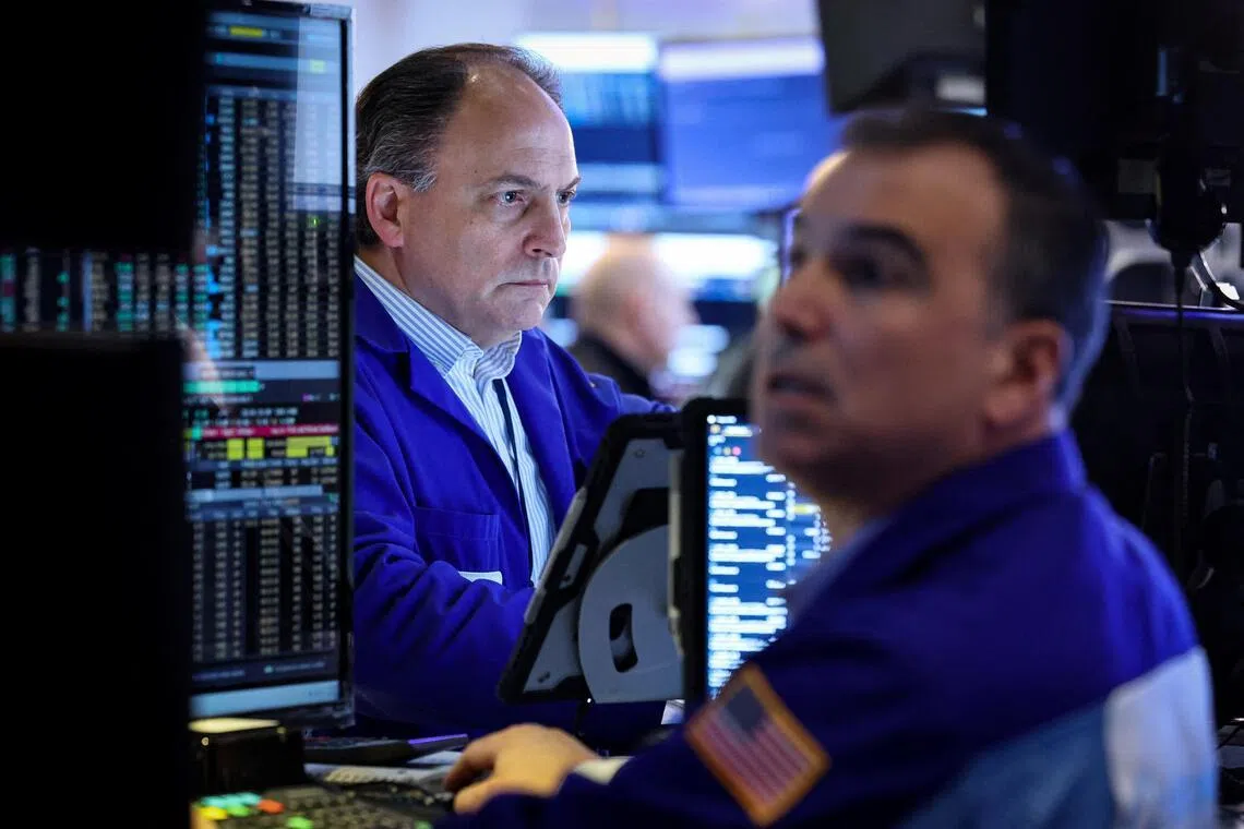 Traders working on the floor of the New York Stock Exchange, in New York City, on Jan 21.