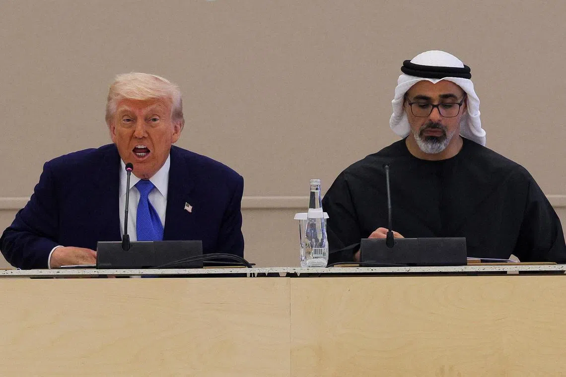 U.S. President Donald Trump speaks next to Crown Prince of Abu Dhabi Sheikh Khaled bin Mohamed bin Zayed Al Nahyan during roundtable discussion, at a business forum at Qasr Al Watan, during the final stop of his Gulf visit, in Abu Dhabi, United Arab Emirates, May 16, 2025. REUTERS/Brian Snyder