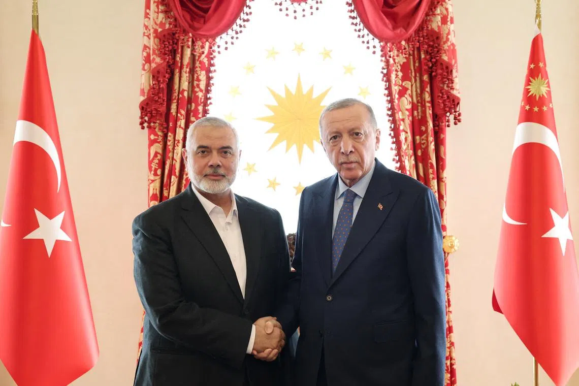 Turkey's President Tayyip Erdogan meets with Ismail Haniyeh, leader of the Palestinian Islamist group Hamas, in Istanbul, Turkey, April 20, 2024. Murat Cetinmuhurdar/Turkish Presidential Press Office/Handout via REUTERS