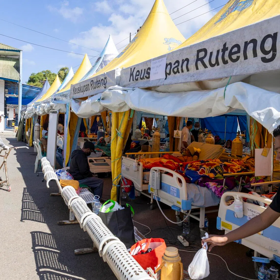 Patients receiving treatment in a makeshift tent outside Ruteng Hospital on Aug 19, following a magnitude 7.7 earthquake in Indonesia’s East Nusa Tenggara province.