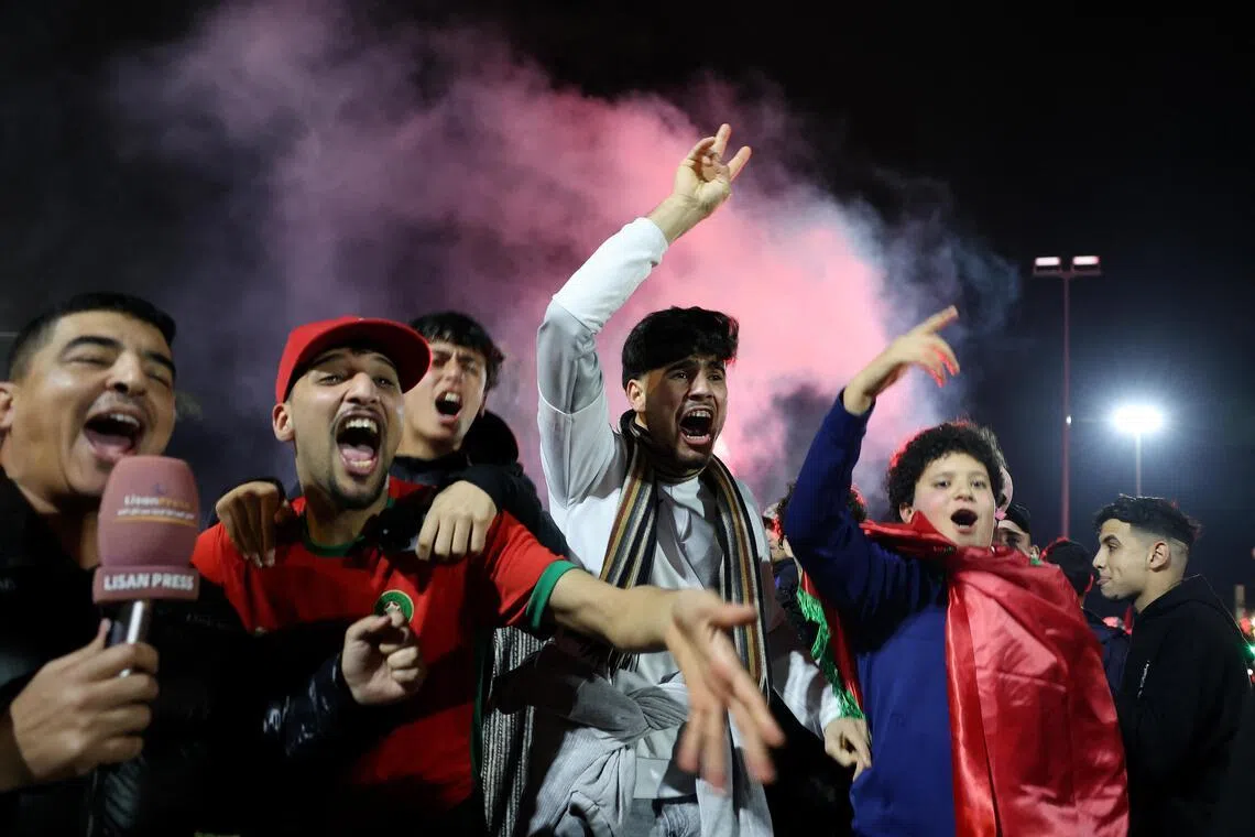 Morocco fans celebrate on the streets after their team won their Africa Cup of Nations semi-final against Nigeria.