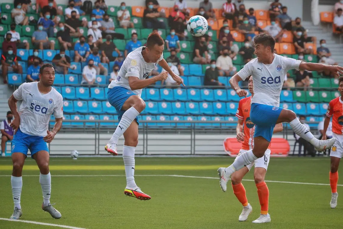 Kim Shin-wook (centre) heading home Lion City Sailors’ equaliser in their 3-1 Singapore Premier League win over Hougang United at the Jalan Besar Stadium on Feb 27, 2022. He signed a three-year deal with Hong Kong side Kitchee SC on Thursday.