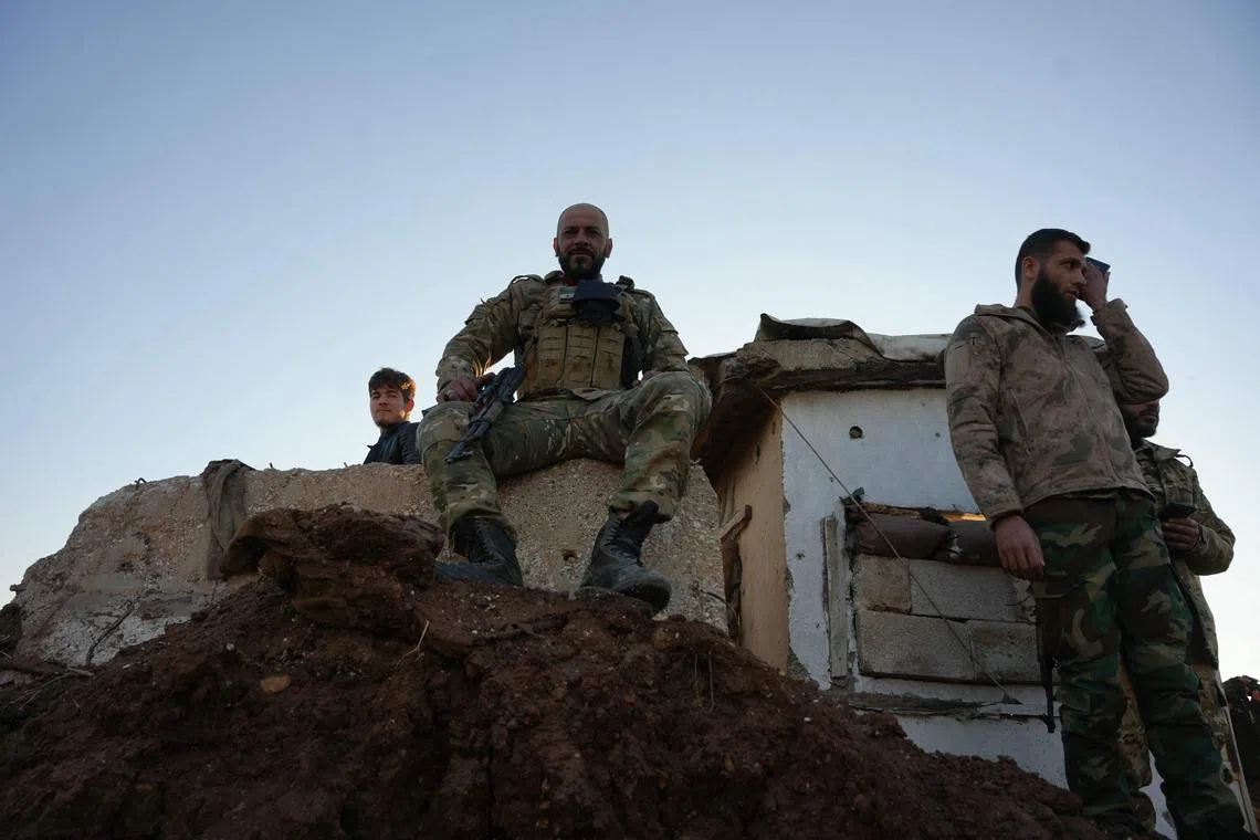 Anti-government fighters reach the highway near the the northern Syrian town of Azaz on Dec 1.