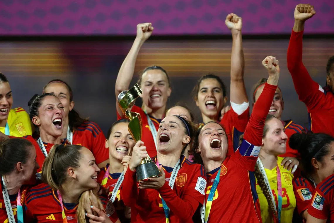 FILE PHOTO: Soccer Football - FIFA Women's World Cup Australia and New Zealand 2023 - Final - Spain v England - Stadium Australia, Sydney, Australia - August 20, 2023 Spain celebrate with the trophy after winning the world cup REUTERS/Hannah Mckay/File Photo