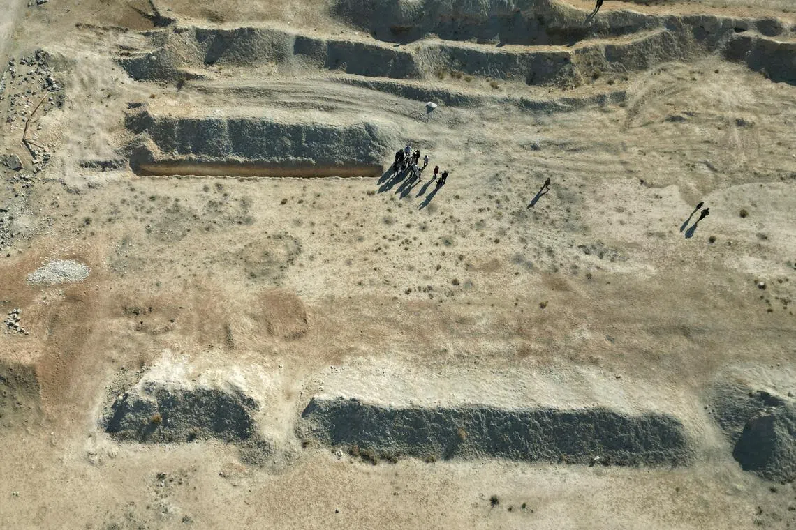 A drone view shows the site of a mass grave from the rule of Syria's Bashar al-Assad, according to residents, after the ousting of al-Assad, in Najha, Syria, December 17, 2024. REUTERS/Ammar Awad