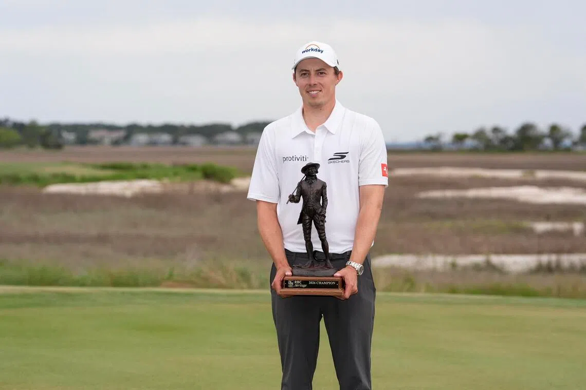 Matt Fitzpatrick celebrates his playoff win and receives his trophy after the overtime win  of the RBC Heritage.