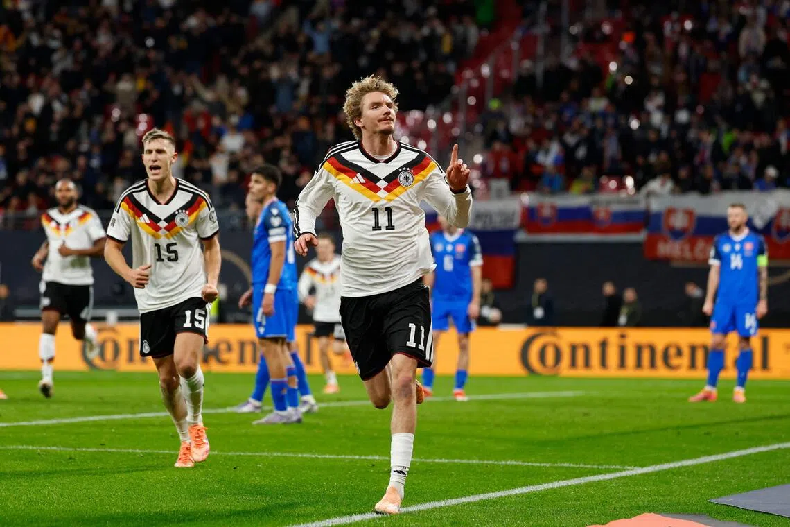Germany forward Nick Woltemade celebrates scoring his team's first goal in the 6-0 World Cup qualifying win over Slovakia in Leipzig on Nov 17, 2025.