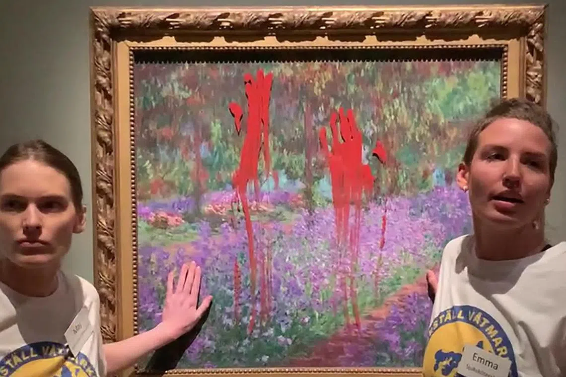Two women smeared paint over Monet's painting, “The Artist’s Garden at Giverny”, and glued their hands to the glass.