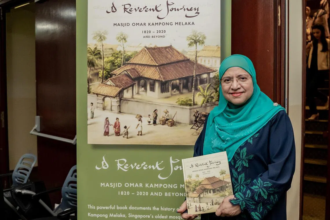 Retired senior librarian Madam Sharifah Zahra Aljunied, 66, with the book A Reverent Journey, which marks the 200-year history of Masjid Omar Kampong Melaka. Madam Zahra, who is one of the book's editors, is a fifth-generation descendent of Syed Omar Aljunied, the founder of the mosque. The book was launched on Saturday, Dec 3, 2002 by President Mdm Halimah Yacob. 