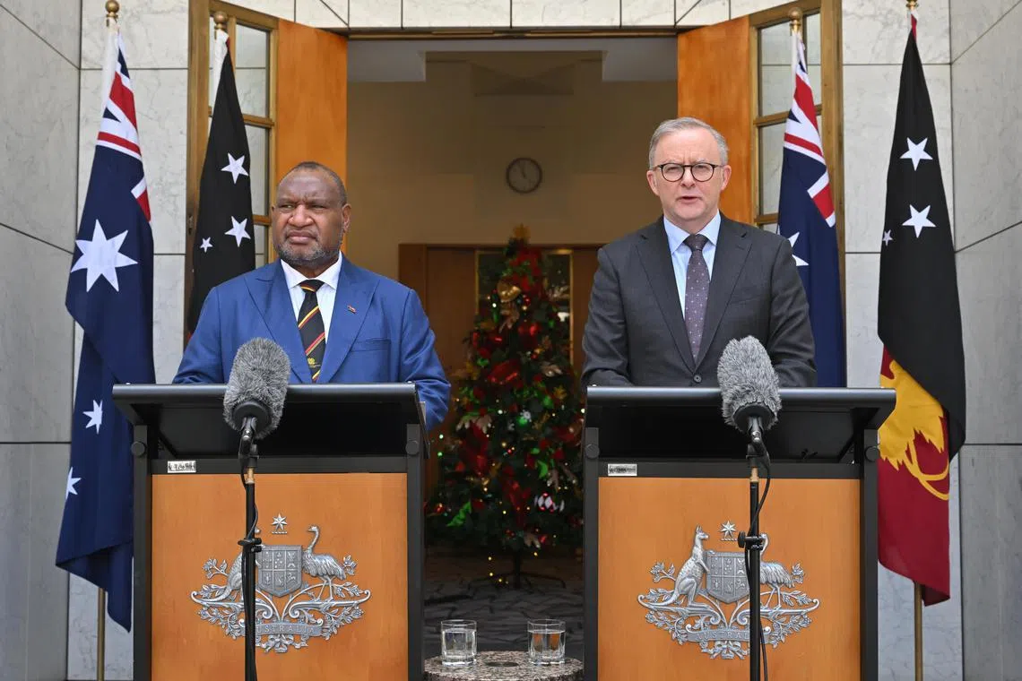 Papua New Guinea's Prime Minister James Marape (left) and Australia's Prime Minister Anthony Albanese at a press conference after signing a Bilateral Security Agreement at Parliament House in Canberra, Australia, 07 December 2023.  