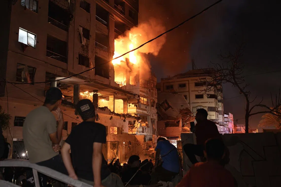 Israeli aircraft launched several strikes on an apartment building in the Al-Rimal neighborhood in central Gaza Strip on May 15.