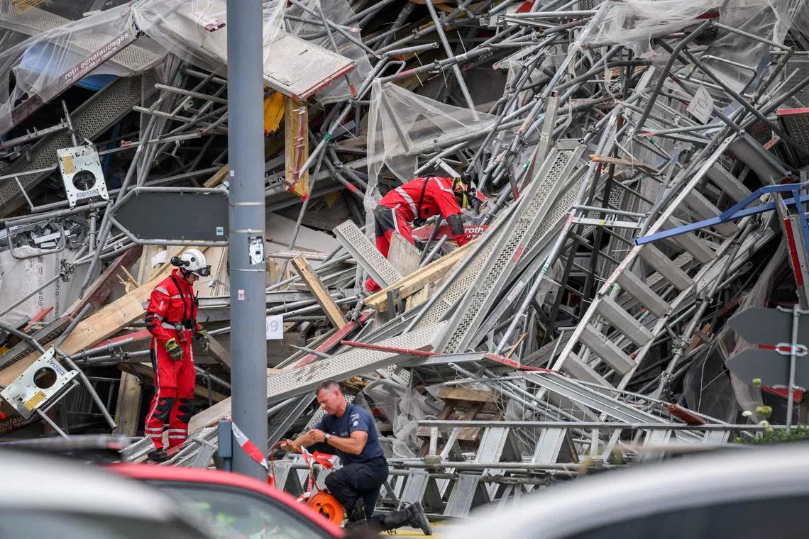 Rescuers work at the site of collapsed scaffolding in the Malley suburb of Lausanne on July 12, 2024.