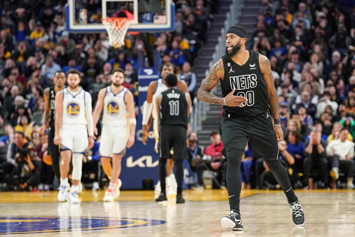Royce O'Neale (foreground) of the Brooklyn Nets celebrates a basket in the fourth quarter against the Golden State Warriors at the Chase Center.