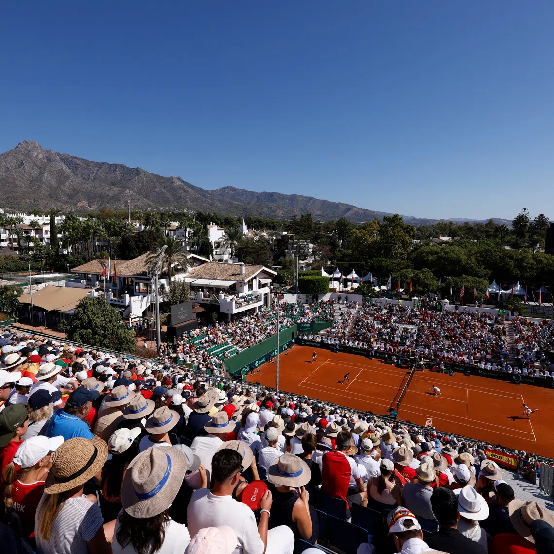 FILE PHOTO: Tennis - Davis Cup - Qualifiers - Second Round - Spain v Denmark - Club de Tenis Puente Romano, Marbella, Spain - September 14, 2025  General view during the doubles match between Denmark's August Holmgren and Denmark's Johannes Ingildsen and Spain's Pedro Martinez and Spain's Jaume Munar REUTERS/Marcelo Del Pozo/ File Photo