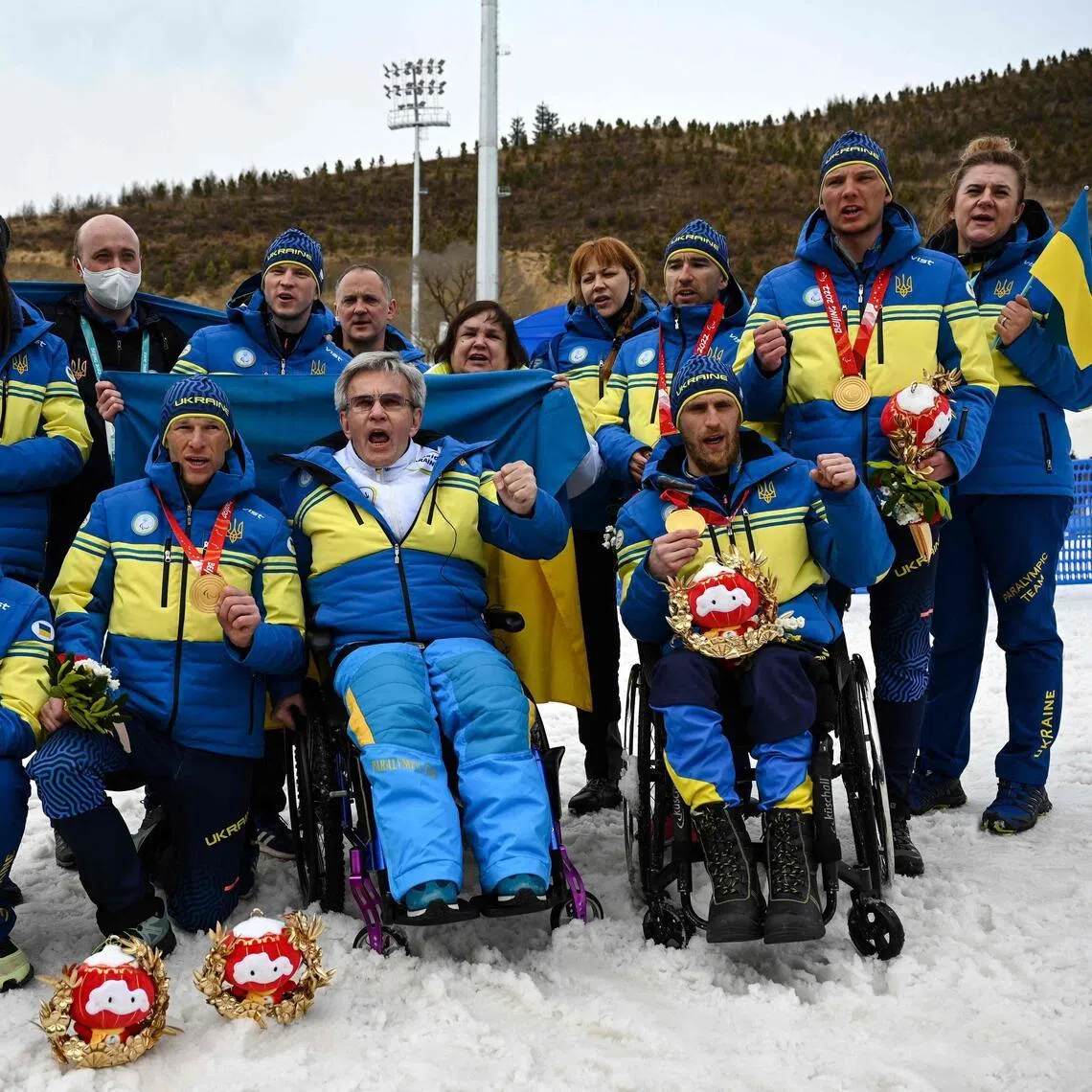 Ukrainian para-athletes gathering around Ukrainian Paralympic Committee president Valeriy Sushkevych during the Beijing 2022 Winter Paralympics. 