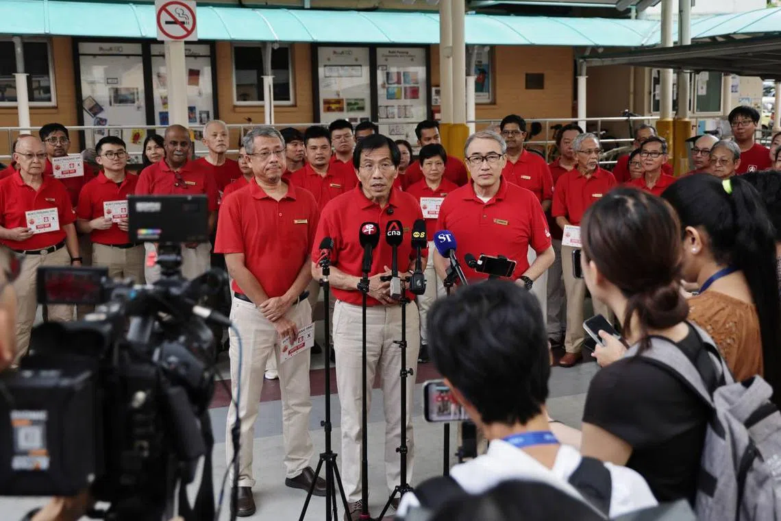 SDP secretary-general Dr Chee Soon Juan (centre) with Sembawang GRC candidates Alfred Tan (right) and Damanhuri Abas leading Saturday's SDP slogan launch on April 19, 2025.