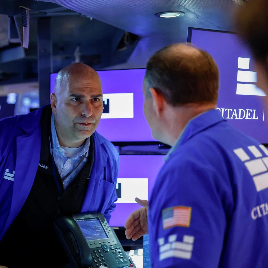 Traders work on the floor of the New York Stock Exchange in New York City.