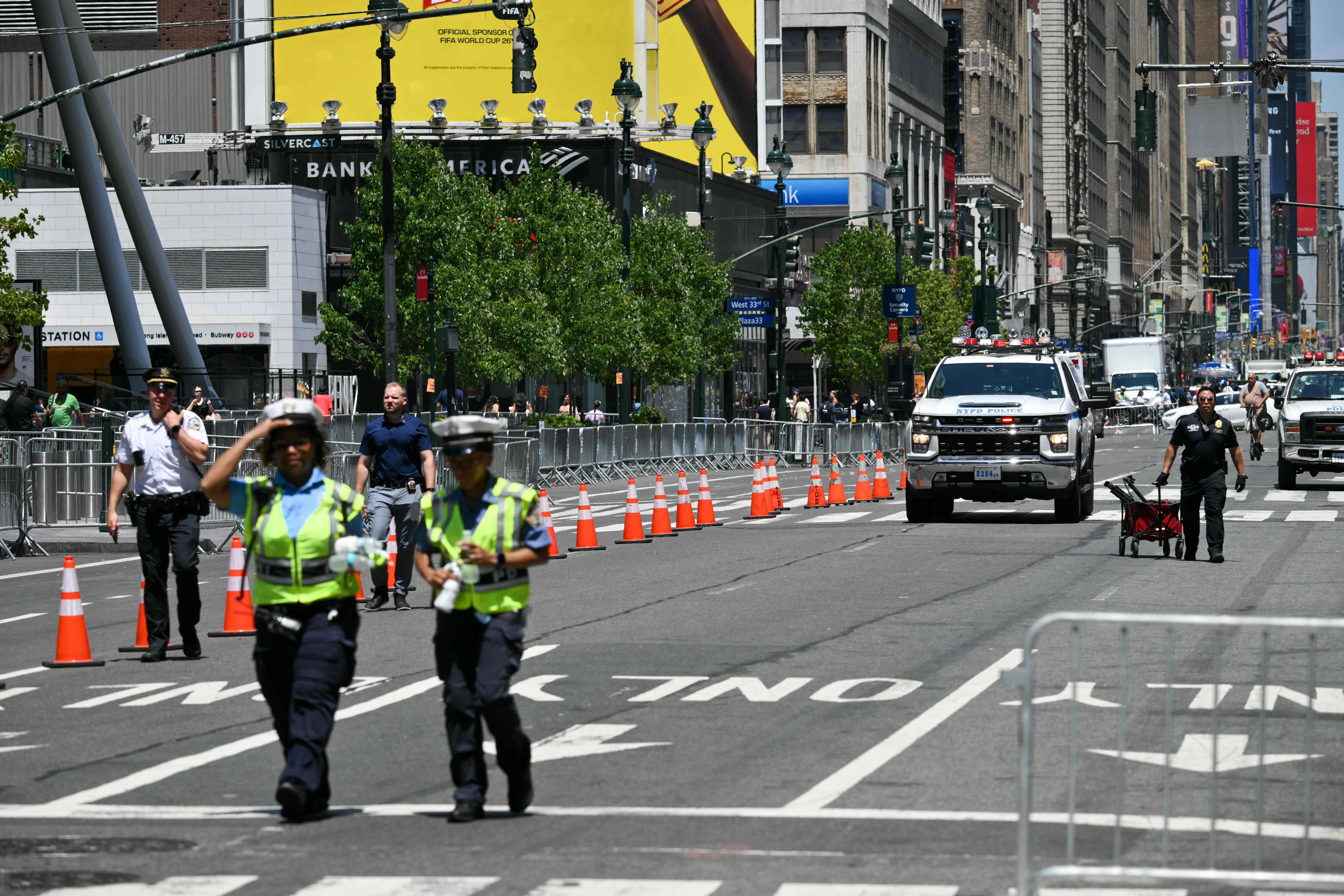 Law enforcement personnel are seen in a closed street near Madison Square Garden, the reported venue for the wedding celebrations of pop singer Taylor Swift and pro-athlete Travis Kelce, in New York City on July 3, 2026. Swift and Kelce's official wedding plans are tightly under wraps, but New York is bracing to host the celebrity marriage of the year this week at Madison Square Garden. The wedding will reportedly take place Friday with a star-studded guest list of around 1,000, including models Gigi Hadid and Cara Delevingne, singer Selena Gomez, and actress Zoe Kravitz -- all known to be close Swift pals -- and Kelce's Kansas City Chiefs teammates. (Photo by ANGELA WEISS / AFP)
