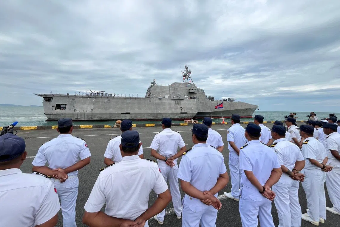 Royal Cambodian Navy personnel line up as the USS Savannah combat ship docks in Cambodia's southern port city of Sihanoukville.