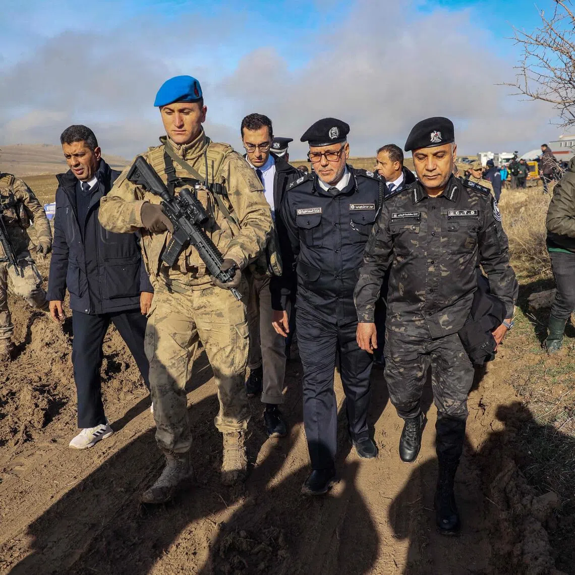 A Libyan military delegation arriving at the scene of the crash in Turkey's Haymana district on Dec 24.