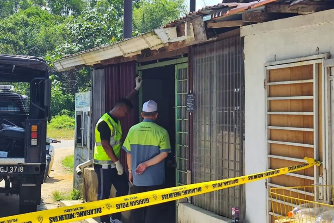 Police investigating the incident at the house of Rubiah Sabtu in Kampung Besol, Terengganu.