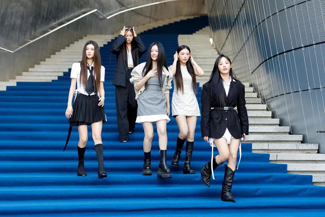K-pop girl group NewJeans announced on Nov 12 that they intend to resume activities with Ador.