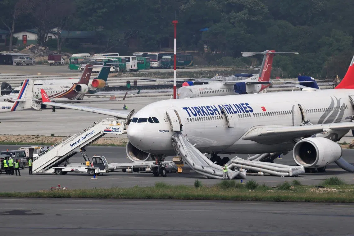 An airbus belonging to Turkish Airlines is parked at Tribhuvan International Airport after a minor fire broke out while landing in Kathmandu, Nepal, on May 11.