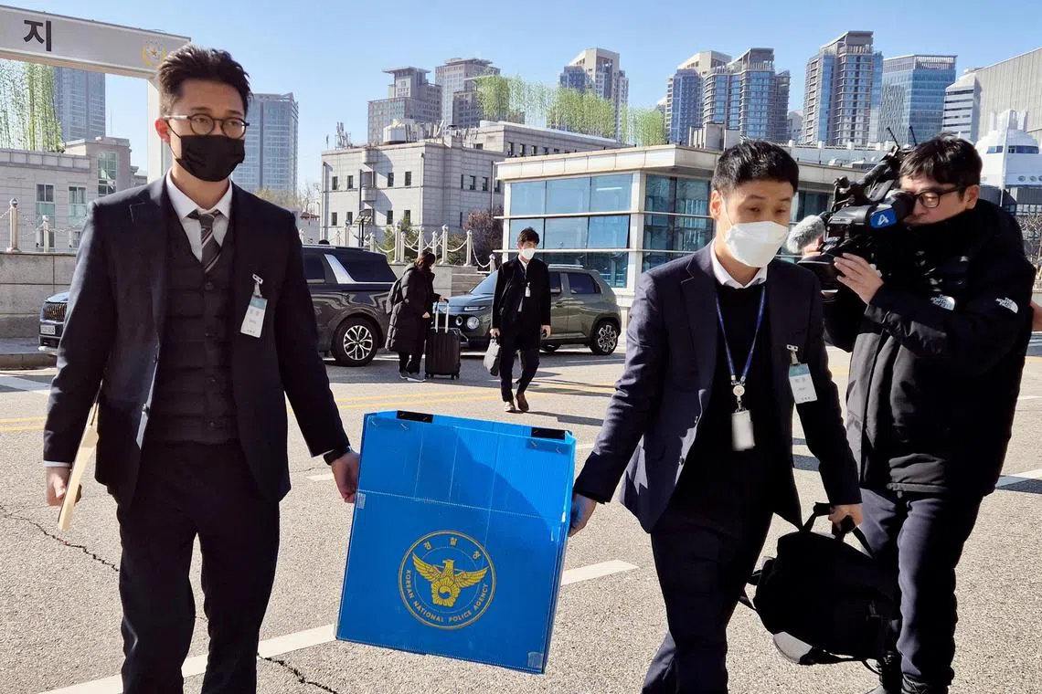 epa11763948 Police investigators enter the office of former Defense Minister Kim Yong-hyun in Seoul, South Korea, 08 December 2024, to seize documents and other materials related to his alleged role in President Yoon Suk Yeol's imposition of emergency martial law last week.  EPA-EFE/YONHAP SOUTH KOREA OUT