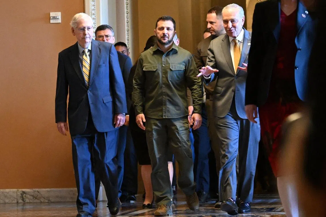 Ukrainian President Volodymyr Zelensky (centre), accompanied by US Senate Majority Leader Chuck Schumer (right)  and Senate Minority Leader Mitch McConnell (left), during a visit to the US Capitol in September 2023.
