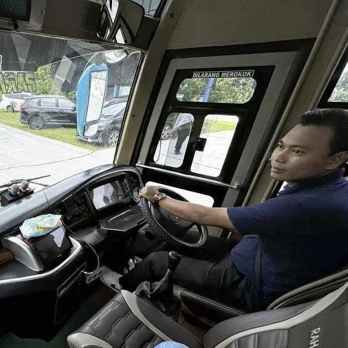 Mr Jejen Kurniawan on a driving course with Japanese road signs at Japan Indonesia Driving School in Indonesia. 