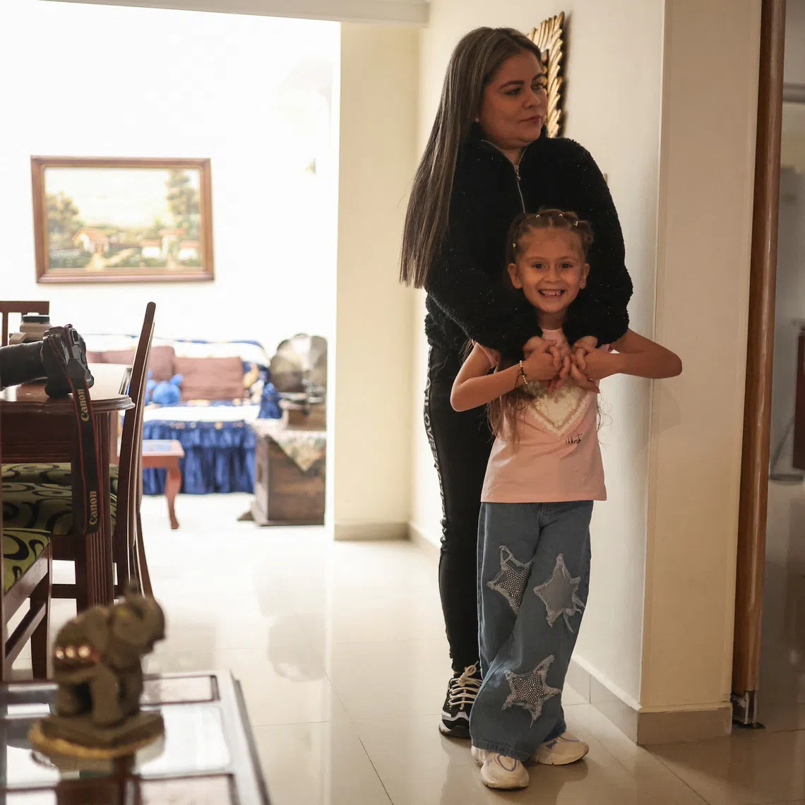 Ms Kelly Vargas with her six-year-old daughter Maria Paola at the place they are staying after being deported from the US.