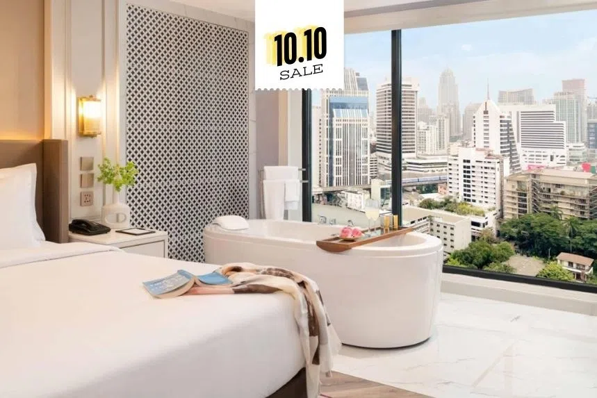 Hotel room with bathtub in room with a city view