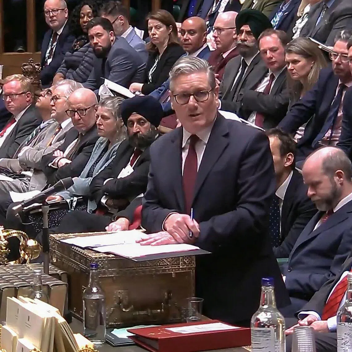 British Prime Minister Keir Starmer (right) speaking in Britain's House of Commons in London on Feb 4.