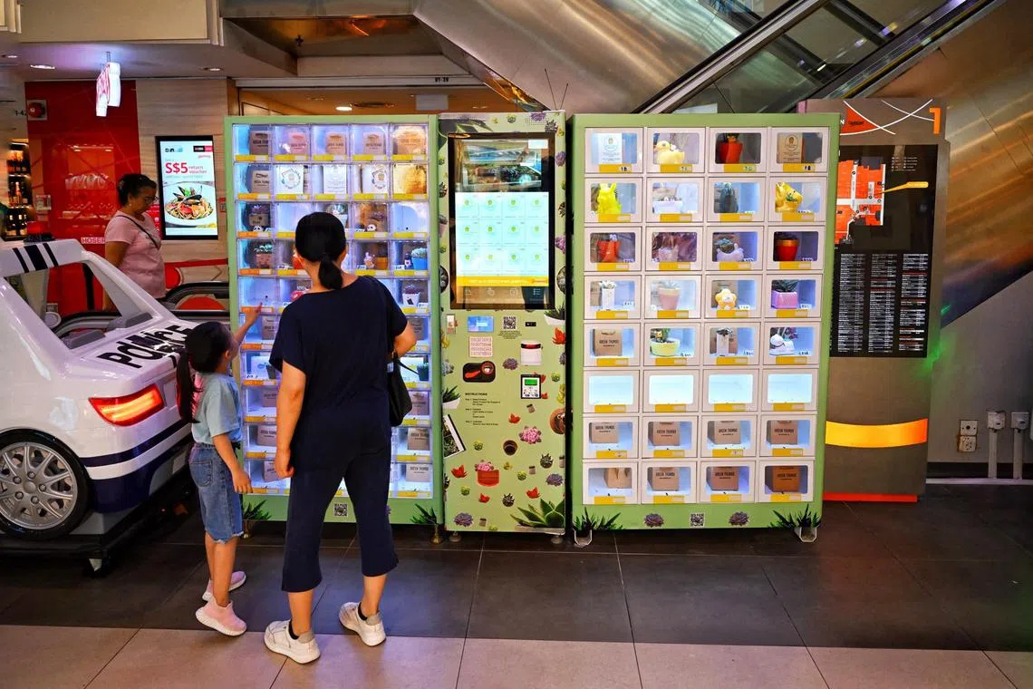 Vending machine selling plants at Junction 8 mall. 

ST Photo: AZMI ATHNI