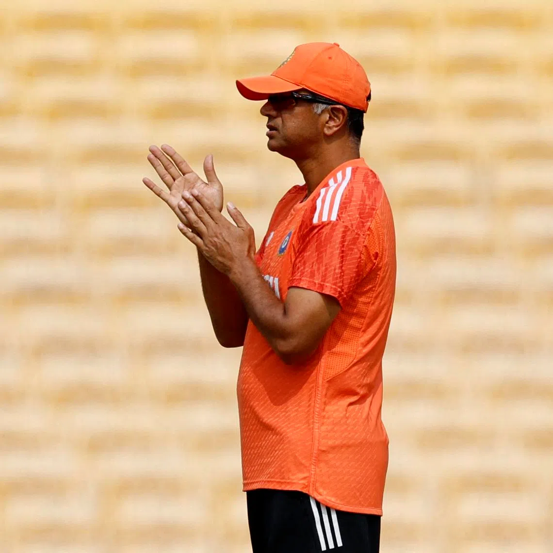 FILE PHOTO: Cricket - ICC Cricket World Cup 2023 - India Practice - MA Chidambaram Stadium, Chennai, India - October 7, 2023 India head coach Rahul Dravid inspects the pitch during practice REUTERS/Adnan Abidi/File Photo