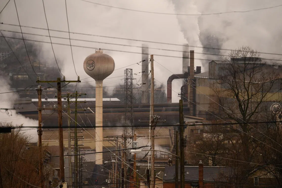 FILE — Steam rises from U.S. Steel's Edgar Thomson Steel Works in Braddock, Pa., March 10, 2023. To save its takeover of U.S. Steel, Japan’s Nippon Steel agreed to an unusual arrangement, granting the White House a “golden share” that gives the government an extraordinary amount of influence over a U.S. company. (Justin Merriman/The New York Times)