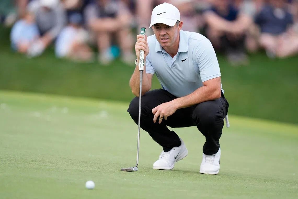 Rory McIlroy eyes his line on 18 during the second round of the Truist Championship.